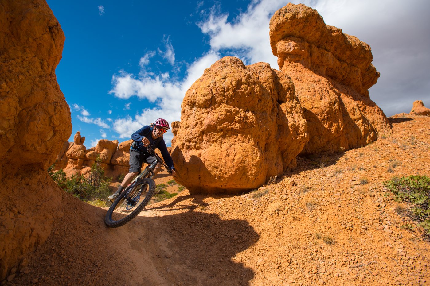 Mountain biker riding through red rock at Thunder Mountain, Utah